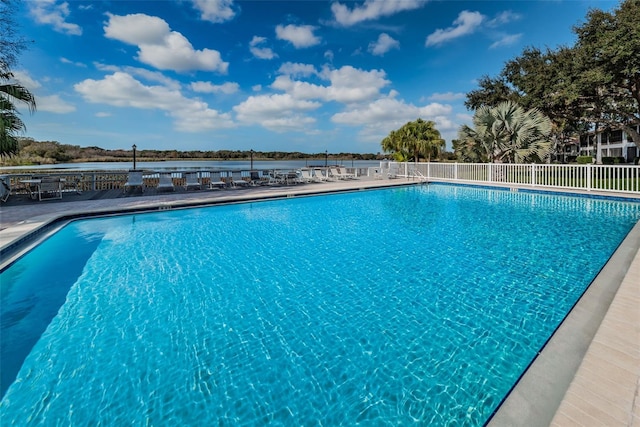 view of pool featuring a water view