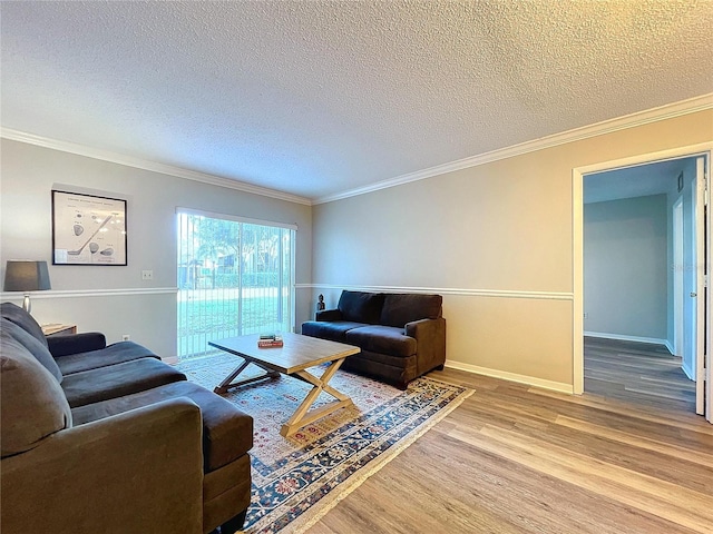 living room featuring crown molding, a textured ceiling, and hardwood / wood-style flooring