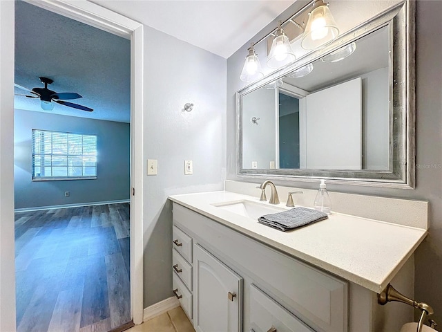 bathroom with vanity and ceiling fan