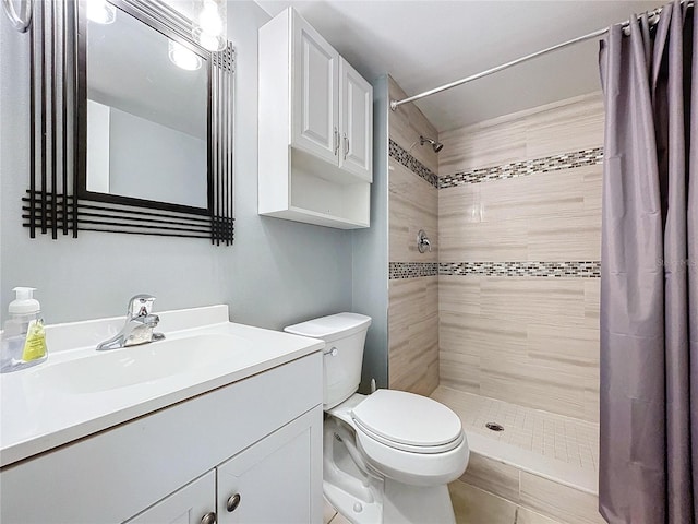 bathroom featuring vanity, toilet, and walk in shower