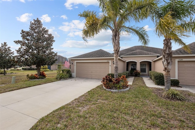 ranch-style home featuring a garage and a front yard