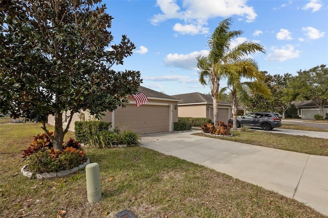 view of front of house featuring a garage and a front yard