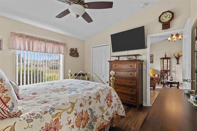 bedroom featuring dark hardwood / wood-style flooring, a closet, ceiling fan, and lofted ceiling