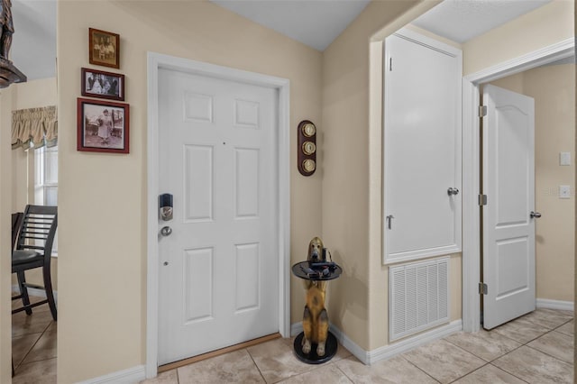 foyer with light tile patterned floors