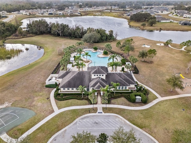 birds eye view of property with a water view