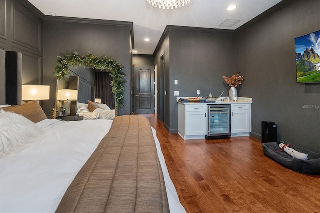 interior space with ornamental molding, wine cooler, white cabinetry, and dark wood-type flooring