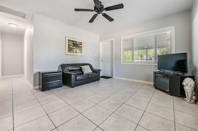 tiled living room featuring ceiling fan