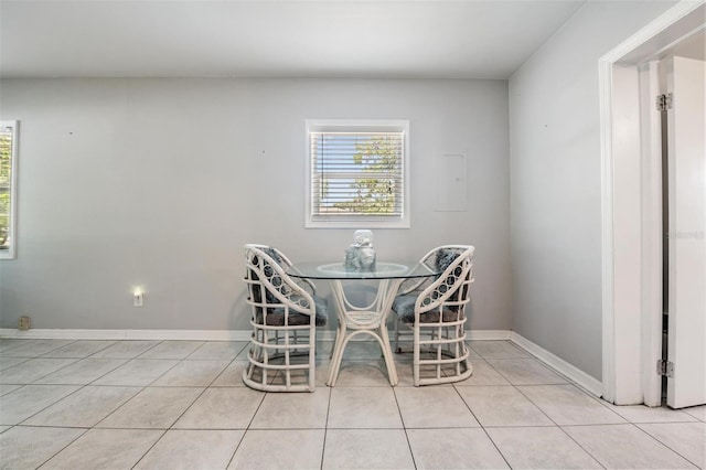 dining space with light tile patterned floors