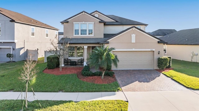 front facade featuring a garage and a front yard