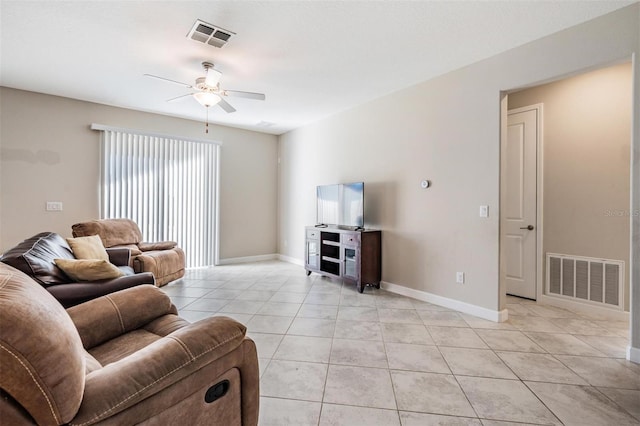 tiled living room with ceiling fan