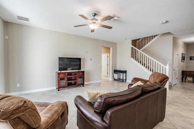 living room featuring ceiling fan and light tile patterned floors