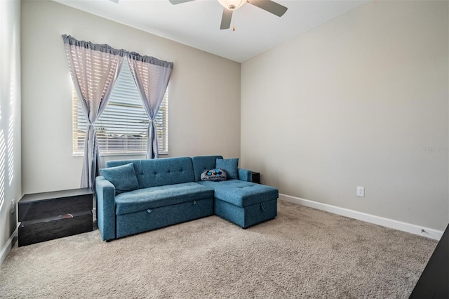 carpeted living room with ceiling fan