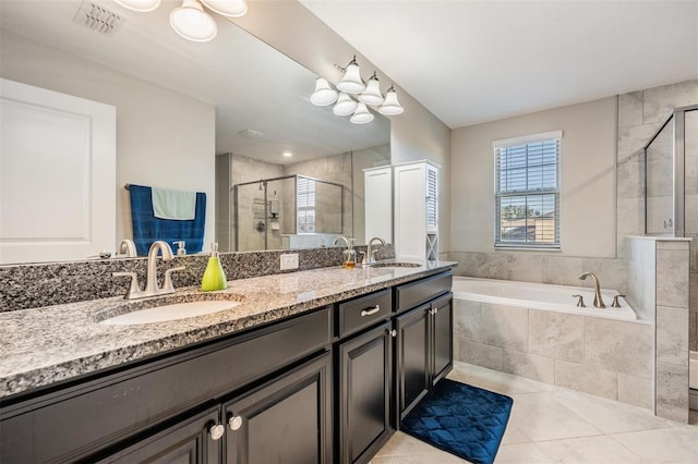 bathroom with separate shower and tub, tile patterned floors, and vanity