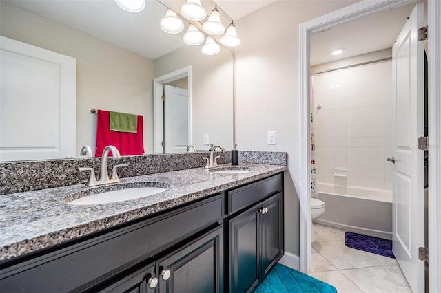 full bathroom featuring tile patterned flooring, vanity, toilet, and shower / washtub combination