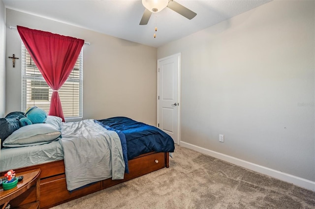 bedroom with ceiling fan and light colored carpet