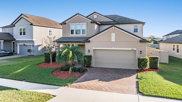 view of front property featuring a garage and a front lawn