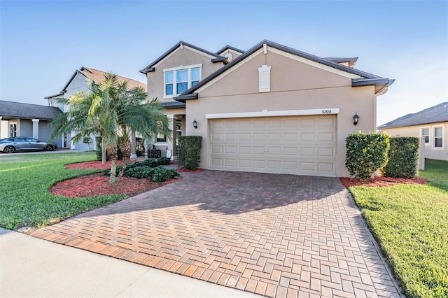 view of front of home with a garage and a front yard