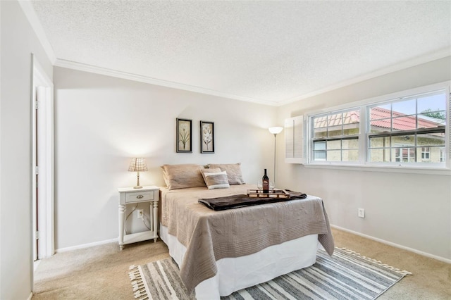 bedroom featuring crown molding, light colored carpet, and a textured ceiling