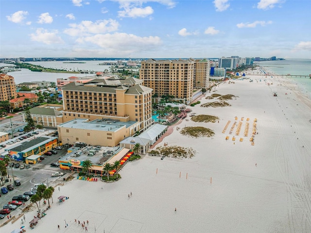 drone / aerial view with a water view and a view of the beach