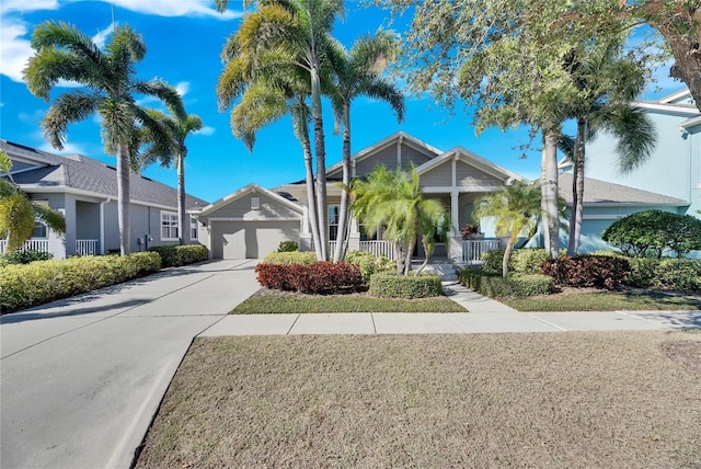 view of front of house with a garage and covered porch