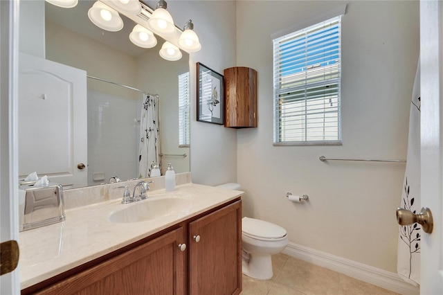 bathroom featuring toilet, a shower with curtain, vanity, and tile patterned floors