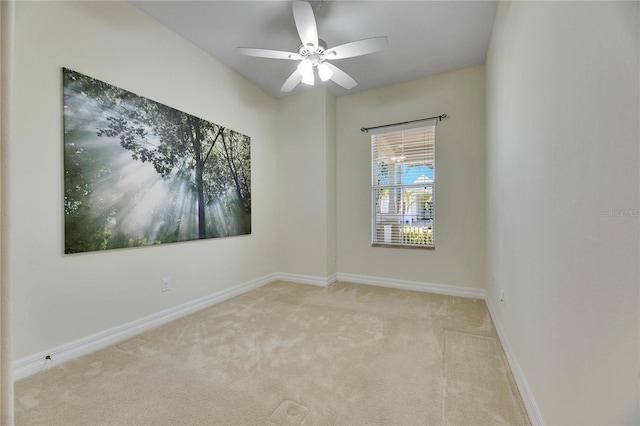 empty room featuring baseboards, a ceiling fan, and carpet flooring