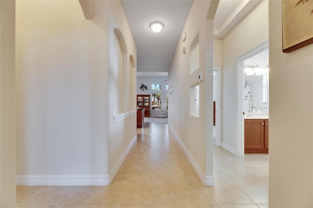 corridor with light tile patterned flooring