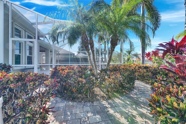 view of patio / terrace featuring a lanai