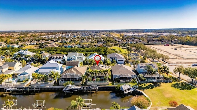 birds eye view of property featuring a residential view and a water view