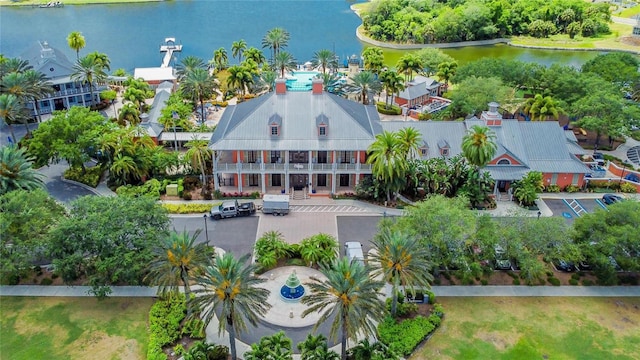 birds eye view of property with a water view