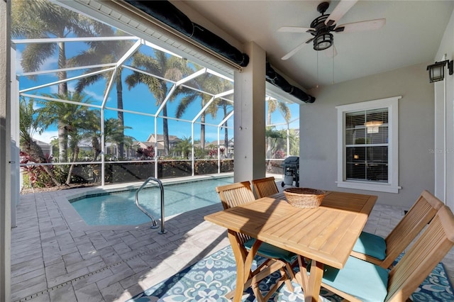 pool with a lanai, grilling area, a patio area, and ceiling fan