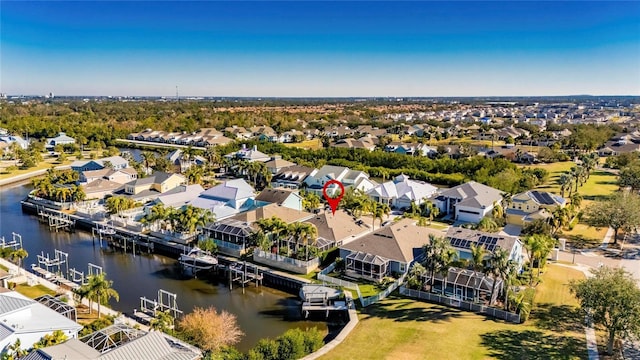 birds eye view of property featuring a residential view and a water view