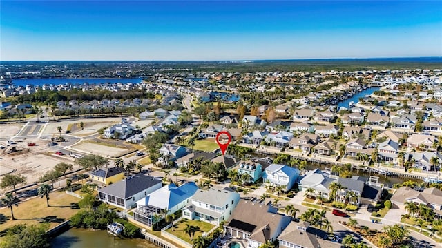 bird's eye view featuring a residential view and a water view