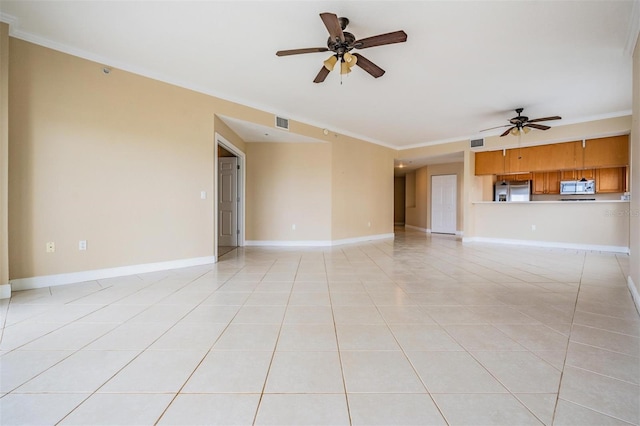 tiled spare room featuring ceiling fan and crown molding