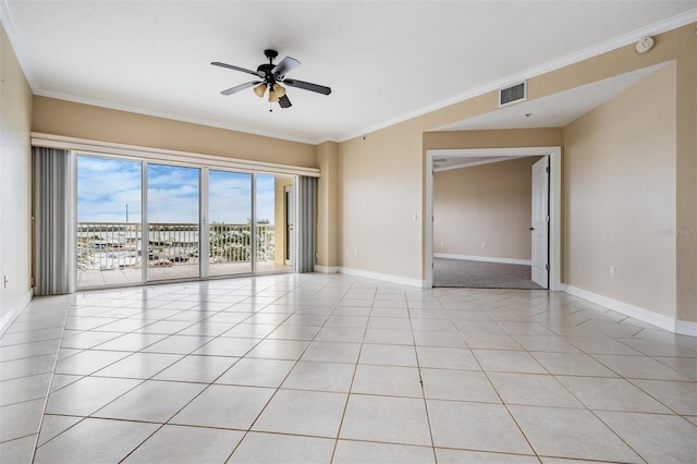 unfurnished room featuring light tile patterned floors, ceiling fan, and ornamental molding