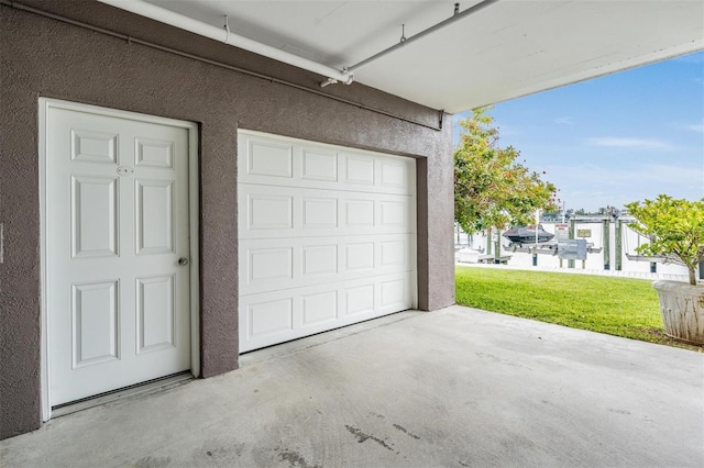 garage with a lawn