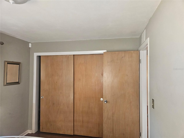 unfurnished bedroom with a closet