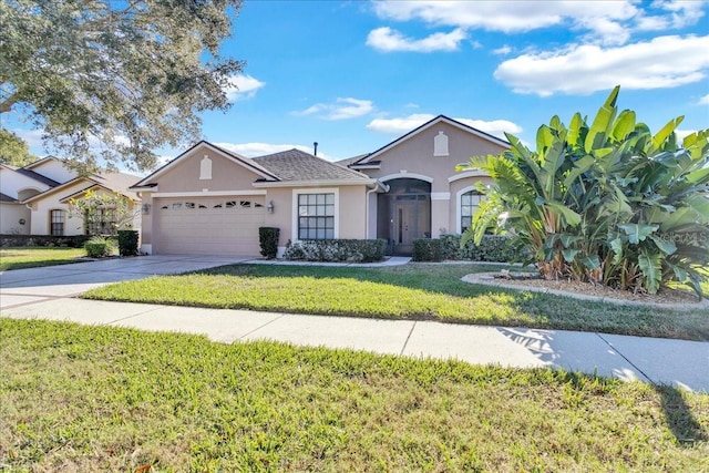 ranch-style house with a garage and a front lawn