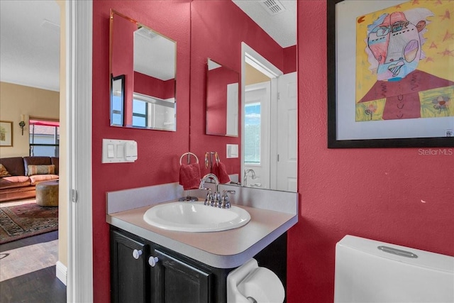 bathroom with vanity and toilet