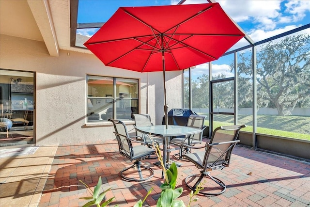 view of patio featuring a lanai