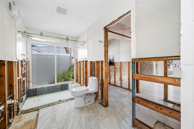 bathroom featuring toilet and shower / bathtub combination