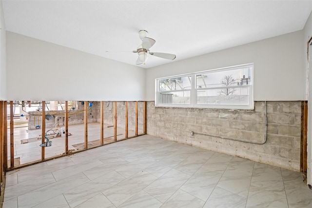 unfurnished room with ceiling fan