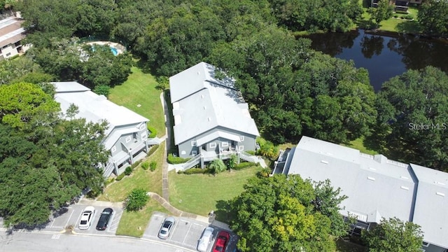 birds eye view of property with a water view