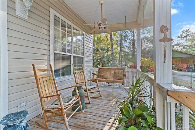 deck with a porch and ceiling fan