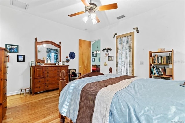 bedroom with light hardwood / wood-style floors and ceiling fan