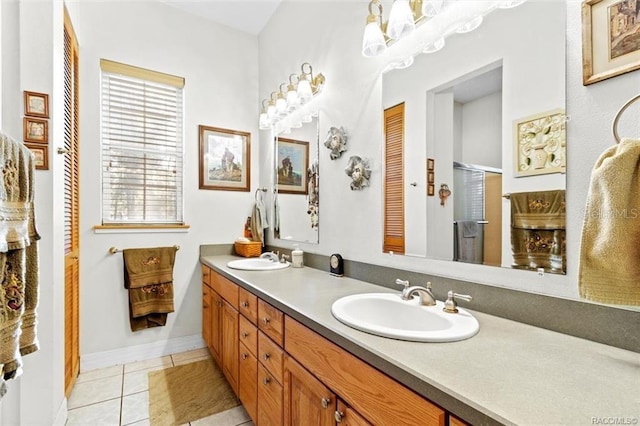 bathroom featuring tile patterned floors, vanity, and an enclosed shower