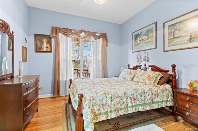 bedroom with light hardwood / wood-style floors and ceiling fan