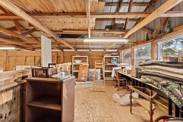 interior space featuring hardwood / wood-style floors and lofted ceiling