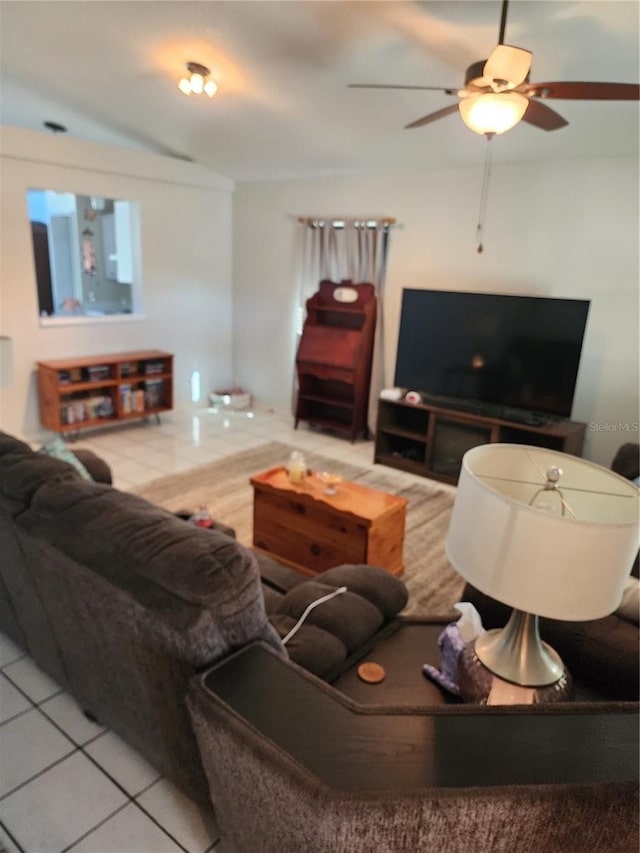 living room featuring tile patterned flooring and ceiling fan