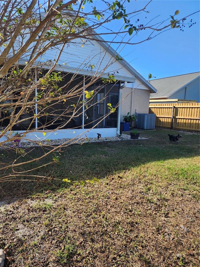 view of yard featuring a sunroom